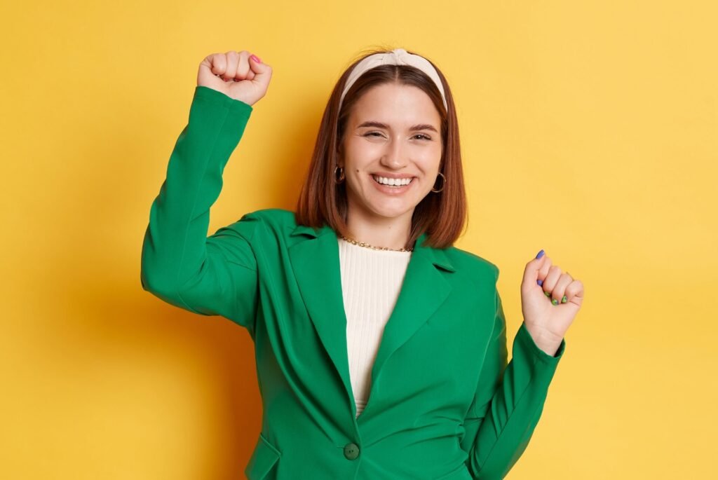 Confident woman celebrating success in staff training.