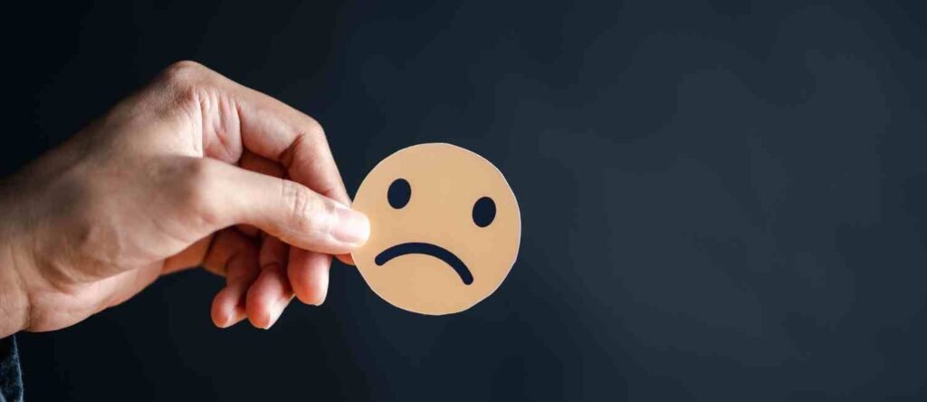 A sad-faced sticker representing frustration and inefficiency caused by unclear HR processes.