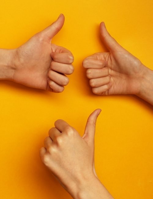 Three hands giving thumbs up – symbolising trust, protection, and expert HR support.